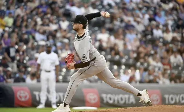 Arizona Diamondbacks starting pitcher Ryne Nelson throws in the first inning of a baseball game against the Colorado Rockies, Saturday, Aug. 16, 2025, in Denver. (AP Photo/Geneva Heffernan)