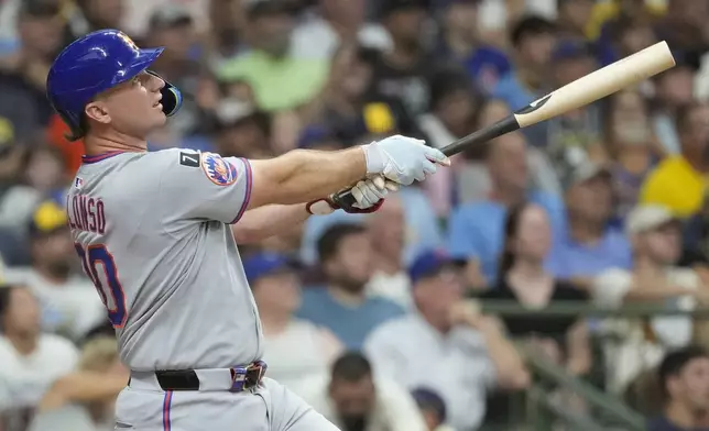 New York Mets' Pete Alonso hits a solo home run during the second inning of a baseball game against the Milwaukee Brewers, Saturday, Aug. 9, 2025, in Milwaukee. (AP Photo/Aaron Gash)