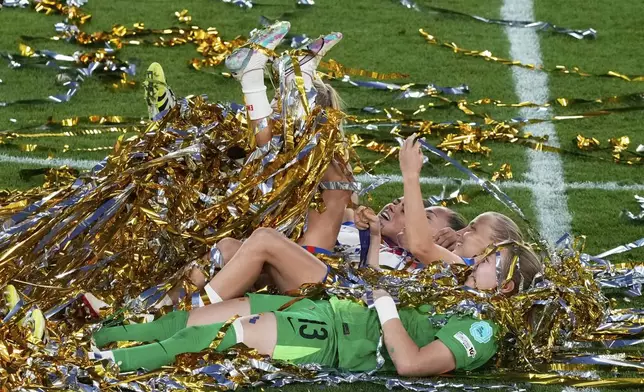 England's players celebrate winning the Women's Euro 2025 final soccer match between England and Spain at St. Jakob-Park in Basel, Switzerland, July 27, 2025. (AP Photo/Michael Probst)