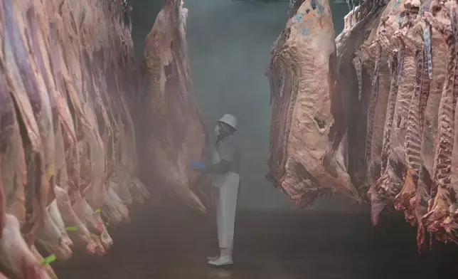 A worker sorts beef carcasses at an export-oriented slaughterhouse in Hermosillo, Mexico, July 28, 2025. (AP Photo/Fernando Llano)