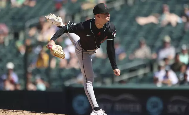 Arizona Diamondbacks pitcher Kyle Nelson throws to an Athletics batter during the ninth inning of a baseball game Sunday, Aug. 3, 2025, in West Sacramento, Calif. (AP Photo/Scott Marshall)