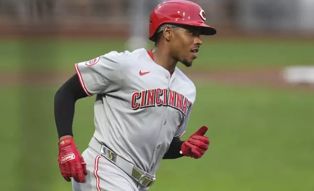 Cincinnati Reds' Ke'Bryan Hayes runs to first base after hitting a single off Pittsburgh Pirates pitcher Paul Skenes during the third inning of a baseball game in Pittsburgh, Thursday, Aug. 7, 2025. (AP Photo/Gene J. Puskar)