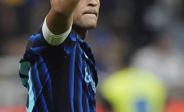 Inter Milan's Lautaro Martinez celebrates scoring his side's 3rd goal during a Serie A soccer match between Inter Milan and Torino, at the San Siro stadium in Milan, Italy, Monday, Aug. 25, 2025. (AP Photo/Luca Bruno)