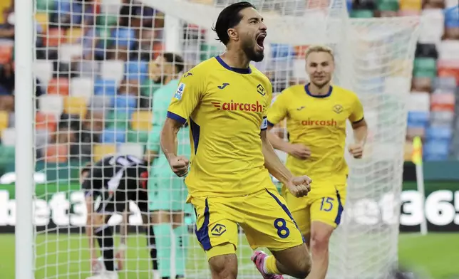 Verona's Suat Serdar celebrates scoring their side's first goal of the game during the Italian Serie A soccer match between Udinese and Hellas Verona at the Bluenergy Stadium in Udine, Italy, Monday, Aug. 25, 2025. (Andrea Bressanutti/LaPresse via AP)