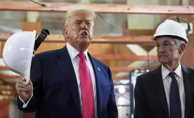 President Donald Trump speaks as Federal Reserve Chairman Jerome Powell listens during a visit to the Federal Reserve, Thursday, July 24, 2025, in Washington. (AP Photo/Julia Demaree Nikhinson)