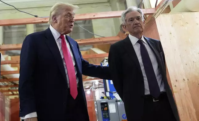 President Donald Trump, left, speaks with Federal Reserve Chairman Jerome Powell during a visit to the Federal Reserve, Thursday, July 24, 2025, in Washington. (AP Photo/Julia Demaree Nikhinson)
