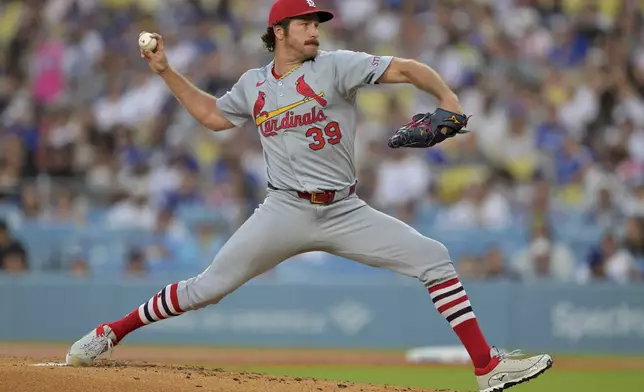 St. Louis Cardinals starting pitcher Miles Mikolas delivers to the plate during the first inning of a baseball game against the Los Angeles Dodgers, Tuesday, Aug. 5, 2025, in Los Angeles. (AP Photo/Jayne Kamin-Oncea)