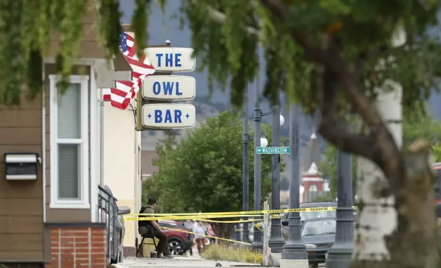 Police tape surrounds The Owl Bar in of Anaconda, Mont., on Friday, Aug. 1, 2025, following a fatal shooting. (Joseph Scheller/The Montana Standard via AP)