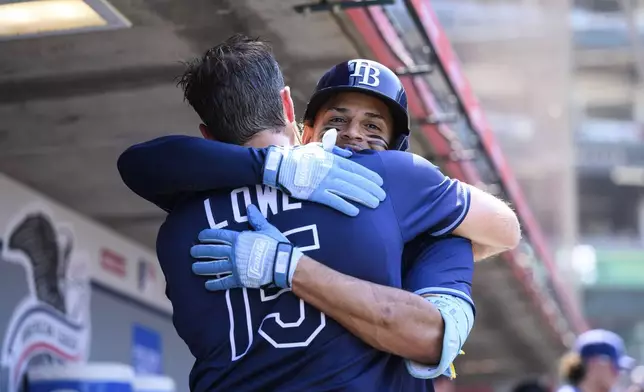 Tampa Bay Rays' Christopher Morel, right, is greeted by Josh Lowe after hitting a home run during the seventh inning of a baseball game against the Los Angeles Angels Wednesday, Aug. 6, 2025, in Anaheim, Calif. (AP Photo/William Liang)