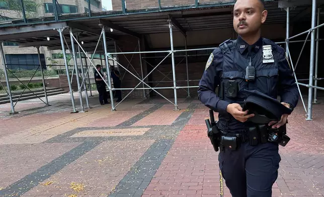 New York Police Department Officer Ishmam Chowdhury stands outside police headquarters in the Manhattan borough of New York on Wednesday, Aug. 6, 2025. (AP Photo/Philip Marcelo)