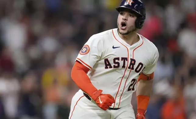 Houston Astros' Yainer Diaz celebrates after hitting a two-run home run against the Boston Red Sox during the sixth inning of a baseball game Wednesday, Aug. 13, 2025, in Houston. (AP Photo/David J. Phillip)