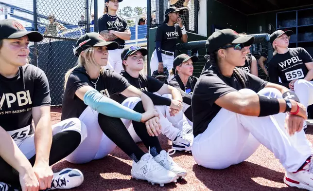 Players, including Mo'ne Davis, listen to coaches introduce themselves during the first day of tryouts for the Women's Professional Baseball League, Friday, Aug 22, 2025, at the Washington Nationals Youth Baseball Academy in Washington. (AP Photo/Julia Demaree Nikhinson)