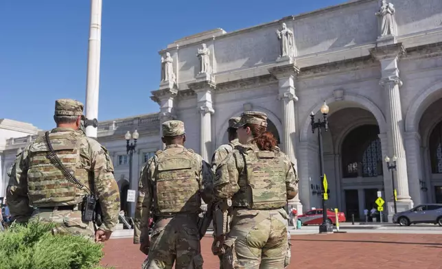 Members of the National Guard are posted at Union Station in Washington, Wednesday, Aug. 27, 2025. (AP Photo/J. Scott Applewhite)