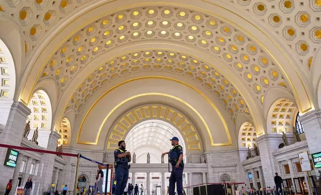 Amtrak Police officers patrol Union Station, Tuesday, Aug. 26, 2025, in Washington. (AP Photo/Mariam Zuhaib)