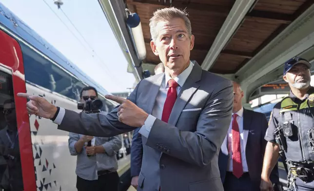 Transportation Secretary Sean Duffy boards the NextGen Acela high-speed rail service en route to Boston, at Union Station in Washington, Wednesday, Aug. 27, 2025. (AP Photo/J. Scott Applewhite)
