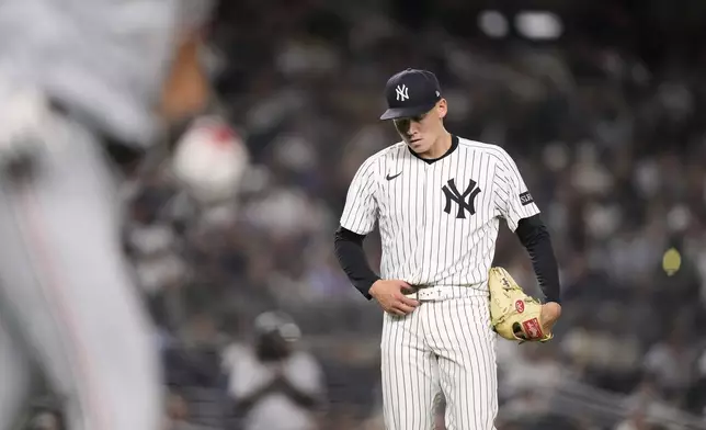 New York Yankees pitcher Will Warren reacts as Minnesota Twins' Trevor Larnach runs the bases after hitting a home run during the seventh inning of a baseball game Monday, Aug. 11, 2025, in New York. (AP Photo/Frank Franklin II)