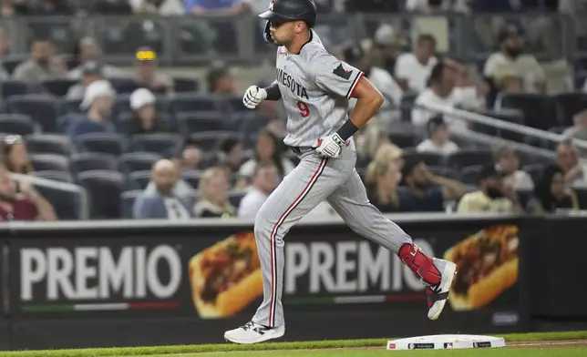 Minnesota Twins' Trevor Larnach (9) runs the bases after hitting a home run during the seventh inning of a baseball game against the New York Yankees Monday, Aug. 11, 2025, in New York. (AP Photo/Frank Franklin II)