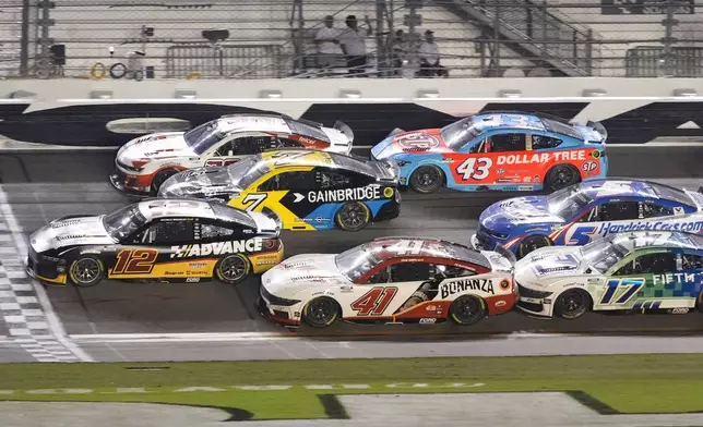 Ryan Blaney (12) crosses the finish line to win a NASCAR Cup Series auto race ahead of at Daytona International Speedway, Saturday, Aug. 23, 2025, in Daytona Beach, Fla. (AP Photo/John Raoux)