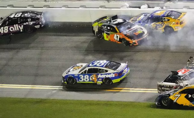 Alex Bowman (48), Zane Smith (38), Ricky Stenhouse Jr. (47), Noah Gragson (4), Justin Haley (7), Bubba Wallace (23) and Austin Cindric (2) get caught up in a multi car crash during a NASCAR Cup Series auto race at Daytona International Speedway, Saturday, Aug. 23, 2025, in Daytona Beach, Fla. (AP Photo/John Raoux)