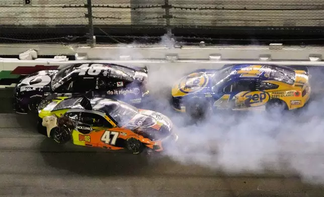 Alex Bowman (48), Ricky Stenhouse Jr. (47) and Noah Gragson (4) get caught up in a crash on the front stretch during a NASCAR Cup Series auto race at Daytona International Speedway, Saturday, Aug. 23, 2025, in Daytona Beach, Fla. (AP Photo/John Raoux)