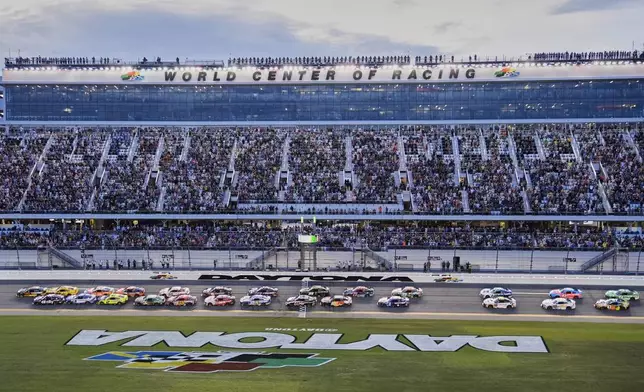 Ryan Blaney and Alex Bowman, far left, lead the field to start a NASCAR Cup Series auto race at Daytona International Speedway, Saturday, Aug. 23, 2025, in Daytona Beach, Fla. (AP Photo/John Raoux)