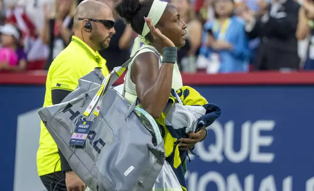 Coco Gauff, right, of the United States, waves to the crowd after her loss to Victoria Mboko, of Canada, during round of 16 match action at the National Bank Open women's tennis tournament in Montreal, Saturday, Aug. 2, 2025. (Christinne Muschi/The Canadian Press via AP)
