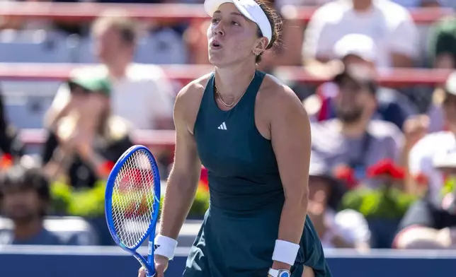 Jessica Pegula, of the United States, reacts during her third-round match against Anastasija Sevastova, of Latvia, at the National Bank Open women's tennis tournament in Montreal, Friday, Aug. 1, 2025. (Christinne Muschi/The Canadian Press via AP)