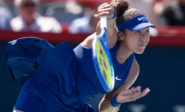 Naomi Osaka, of Japan, serves to Jelena Ostapenko, of Latvia, during the National Bank Open women’s tennis tournament, Friday, Aug. 1, 2025, in Montreal. (Christinne Muschi/The Canadian Press via AP)