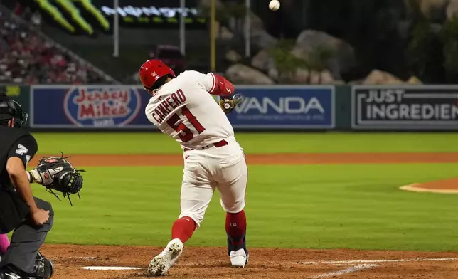 Los Angeles Angels' Gustavo Campero hits a two-run home run during the fifth inning of a baseball game against the Chicago White Sox, Friday, Aug. 1, 2025, in Anaheim, Calif. (AP Photo/Mark J. Terrill)