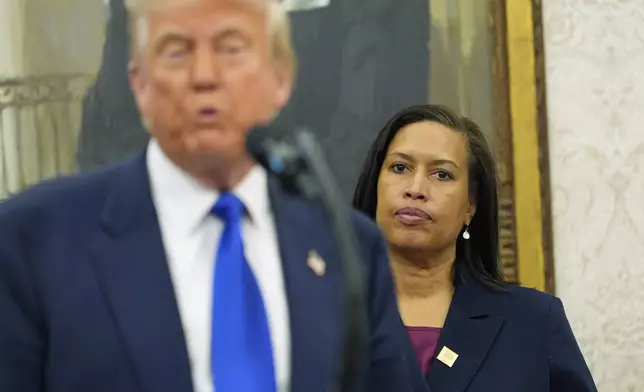 FILE - District of Columbia Mayor Muriel Bowser listens as President Donald Trump speaks during an event to announce that the 2027 NFL Draft will be held on the National Mall, in the Oval Office of the White House, May 5, 2025, in Washington. (AP Photo/Alex Brandon, File)