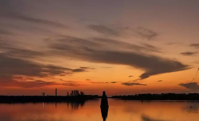 A SpaceX Falcon 9 rocket, left, with the crew Dragon capsule attached, sits on Kennedy Space Center's Launch Pad 39-A Friday, Aug. 1, 2025, in Cape Canaveral, Fla. (AP Photo/Chris O'Meara)