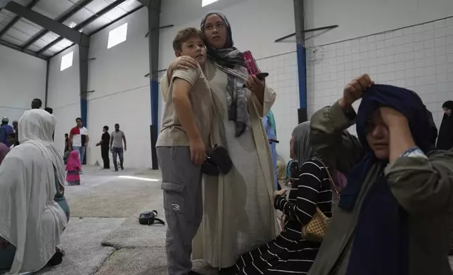 Families attend Friday prayer at the Islamic Center of Cedar Rapids on Friday, Aug. 8, 2025, in Cedar Rapids, Iowa. (AP Photo/Jessie Wardarski)
