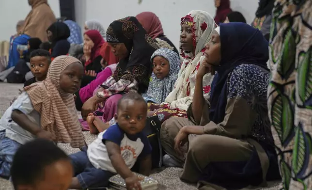 Families attend Friday prayer at the Islamic Center of Cedar Rapids on Friday, Aug. 8, 2025, in Cedar Rapids, Iowa. (AP Photo/Jessie Wardarski)