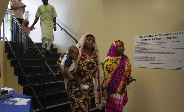 Families attend Friday prayer at the Islamic Center of Cedar Rapids on Friday, Aug. 8, 2025, in Cedar Rapids, Iowa. (AP Photo/Jessie Wardarski)