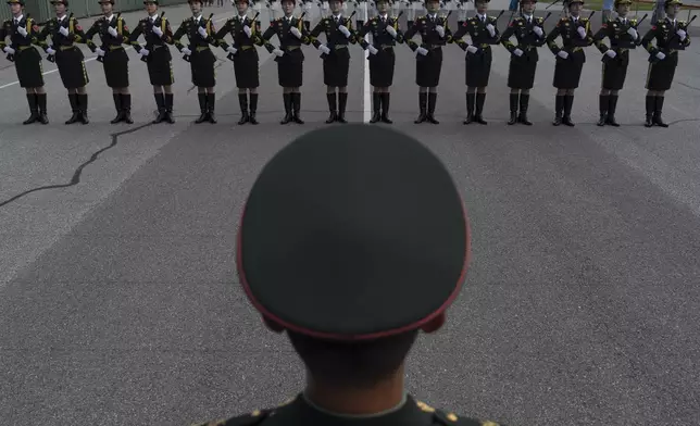 Members of Chinese honor guard contingents go through drills ahead of the Sept. 3rd military parade marking the 80th anniversary of the end of World War II at a military camp on the outskirts of Beijing, Wednesday, Aug. 20, 2025. (AP Photo/Ng Han Guan)