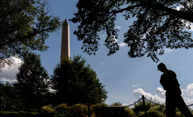 A member of the District of Columbia National Guard patrols along the National Mall, Saturday, Aug. 16, 2025, in Washington. (AP Photo/Julia Demaree Nikhinson)