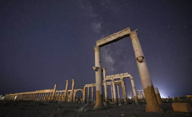 The ruins of the ancient city of Palmyra under a star-studded sky in Syria, in the late hours of Wednesday, Aug. 27, 2025.(AP Photo/Ghaith Alsayed)