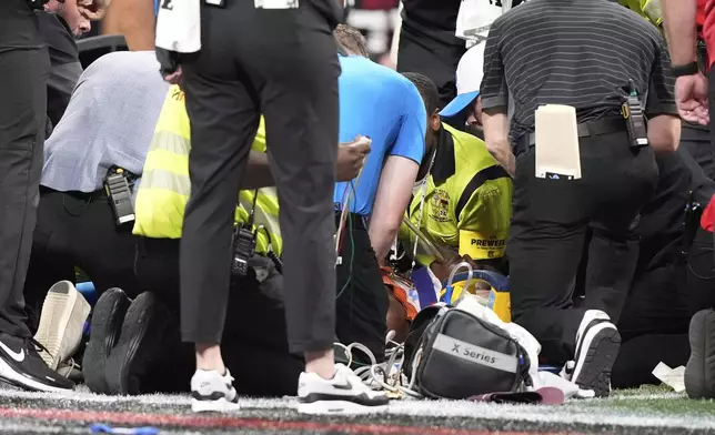 Medical personnel aid Detroit Lions safety Morice Norris (26) after he was injured against the Atlanta Falcons during the second half of an NFL preseason football game Friday, Aug. 8, 2025, in Atlanta. (AP Photo/Brynn Anderson)