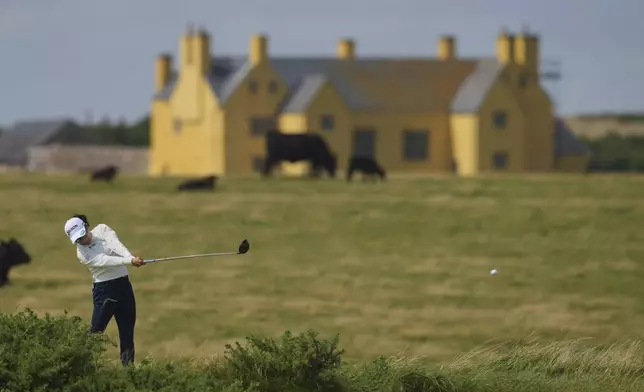 Minami Katsu of Japan plays a shot from the 6th tee during the final round of the Women's British Open golf championship, at Royal Porthcawl Golf Club in Porthcawl, Wales, Sunday, Aug. 3, 2025. (AP Photo/Kin Cheung)