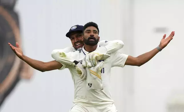 India's Mohammed Siraj and India's Dhruv Jurel celebrate their win against England on day five of the fifth cricket test match between England and India at The Kia Oval in London, Monday, Aug. 4, 2025. (AP Photo/Kirsty Wigglesworth)