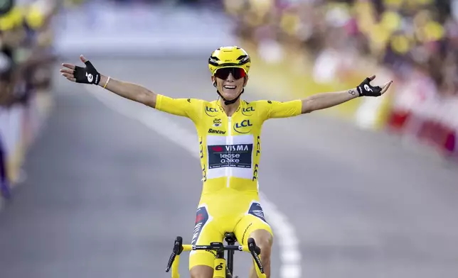 The winner of the Tour de France Femmes Pauline Ferrand-Prevot from France of team Visma - Lease a Bike celebrates as she crosses the finish line to win the 9th stage of the 4th edition of the Women's Tour de France cycling race, 124,1 km from Praz-Sur-Arly to Chatel Les Portes du Soleil, in Chatel, France, Sunday Aug. 3, 2025. (Jean-Christophe Bott/Keystone via AP)
