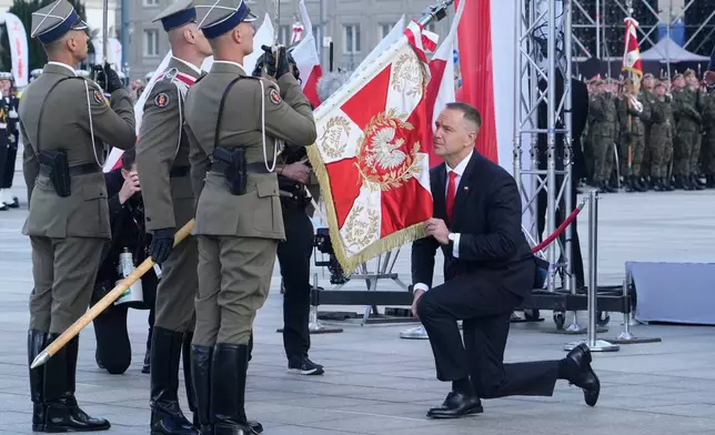 Poland's new President Karol Nawrocki attends an official ceremony to assume command of the Armed Forces at the Tomb of the Unknown Soldier on the Pilsudski square in Warsaw, Poland, Wednesday, Aug. 6, 2025. (AP Photo/Czarek Sokolowski)
