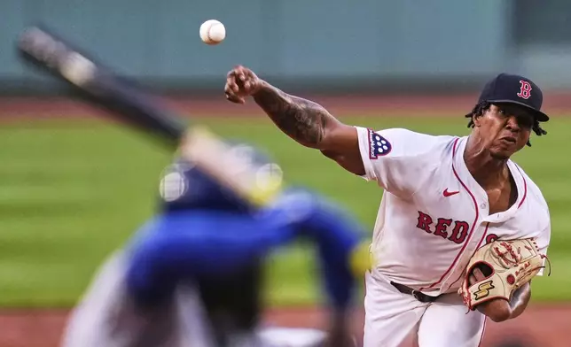 Boston Red Sox pitcher Brayan Bello delivers during the first inning of a baseball game against the Kansas City Royals at Fenway Park, Monday, Aug. 4, 2025, in Boston. (AP Photo/Charles Krupa)