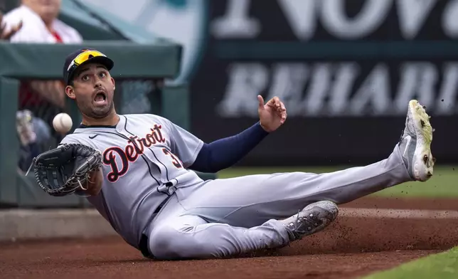 Detroit Tigers left fielder Riley Greene catches the foul ball by Philadelphia Phillies' Kyle Schwarber during the sixth inning of a baseball game, Saturday, Aug. 2, 2025, in Philadelphia. (AP Photo/Chris Szagola)