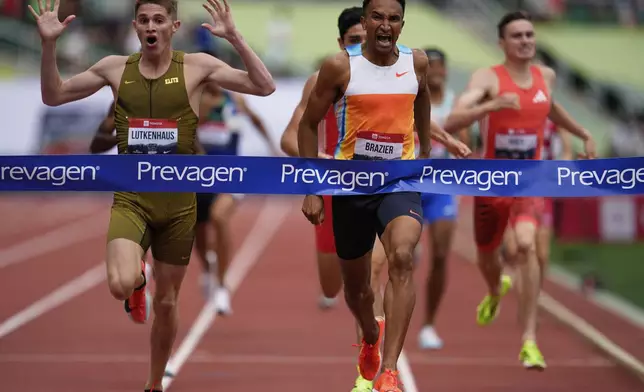 Cooper Lutkenhaus, left, reacts as Donavan Brazier wins the men's 800-meter final at the U.S. Championships athletics meet in Eugene, Ore., Sunday, Aug. 3, 2025. (AP Photo/Abbie Parr)