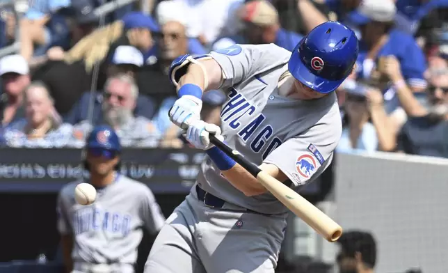 Chicago Cubs' Owen Caissie (19), making his major league debut, flies out against the Toronto Blue Jays during a baseball game, Thursday, Aug. 14, 2025, in Toronto. (Jon Blacker/The Canadian Press via AP)