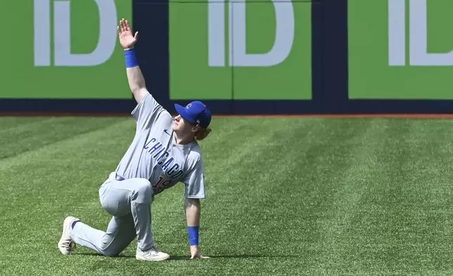 Chicago Cubs' Owen Caissie (19) warms up before taking on the Toronto Blue Jays in a baseball game, Thursday, Aug. 14, 2025, in Toronto. (Jon Blacker/The Canadian Press via AP)