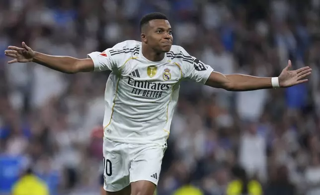 Real Madrid's Kylian Mbappe celebrates after scoring from a penalty kick during the La Liga soccer match between Real Madrid and Osasuna in Madrid, Spain, Tuesday, Aug. 19, 2025. (AP Photo/Manu Fernandez)