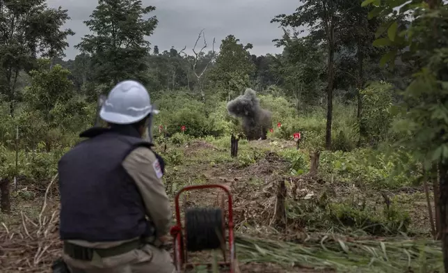 Every one of Cambodia’s 25 provinces is contaminated with landmines, cluster munitions, or other items of unexploded ordnance as a result of years of conflict, including the Vietnam War. The Mines Advisory Group has worked in Cambodia for 30 years, helping to make land safe for communities. In this photo, a supervisor safely detonates a landmine in Battambang Province, an area near the Thai border still deeply scarred by the fighting that ended long ago.