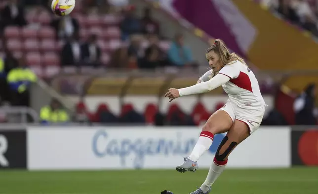 Zoe Harrison of England converts a try during the group A match at the 2025 Women's Rugby World Cup between England and the United States in Sunderland, England, Friday, Aug. 22, 2025. (AP Photo/Scott Heppell)
